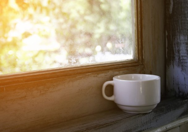 Coffee cup near window - Photo, Image
