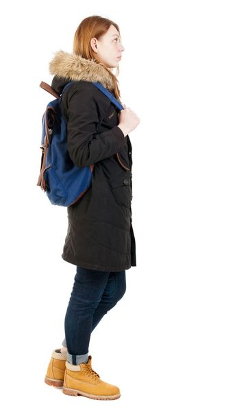 Back view woman in winter jacket with  backpack - Fotografie, Obrázek