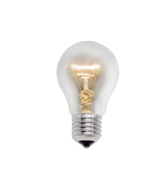 Glowing incandescent lamp on a light background - Photo, Image