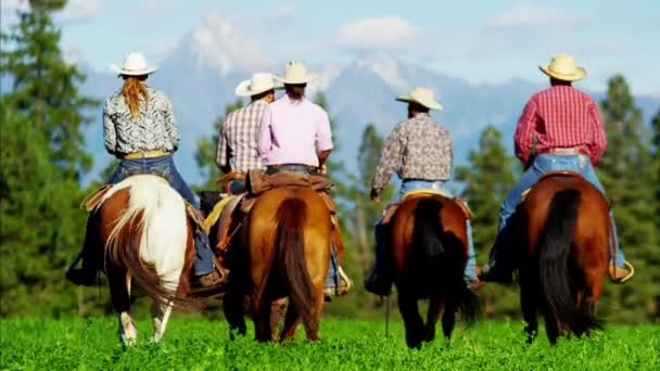 Cowboys and Cowgirls galloping on Mountain Range - Footage, Video