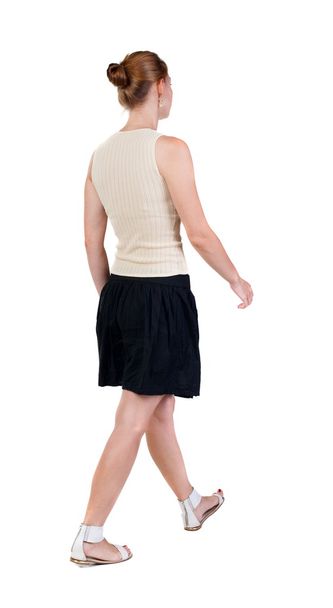 back view of walking  woman in dress. beautiful blonde girl in m - Фото, зображення