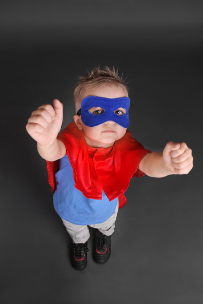 Superhero kid on grey background - Photo, Image
