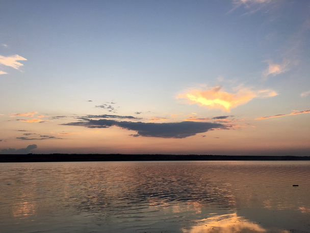 evening sunset over a lake with clouds - Fotó, kép