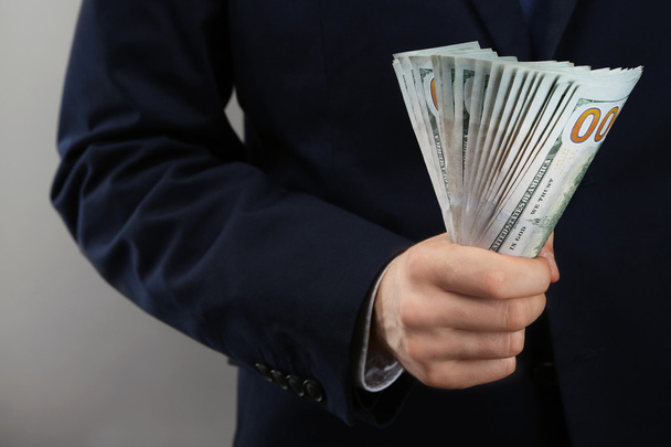 Businessman with money in hand - Valokuva, kuva