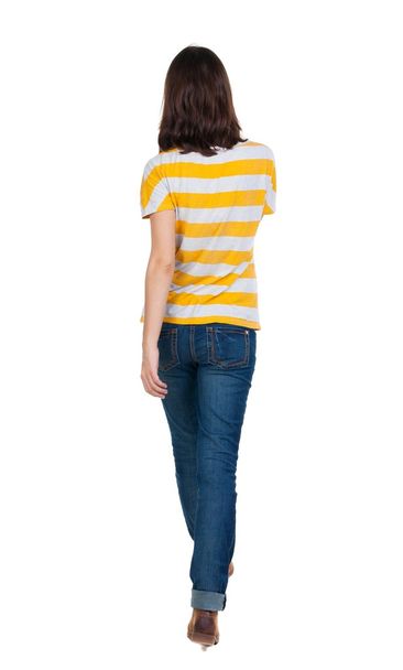 back view of walking  woman in jeans . - Zdjęcie, obraz