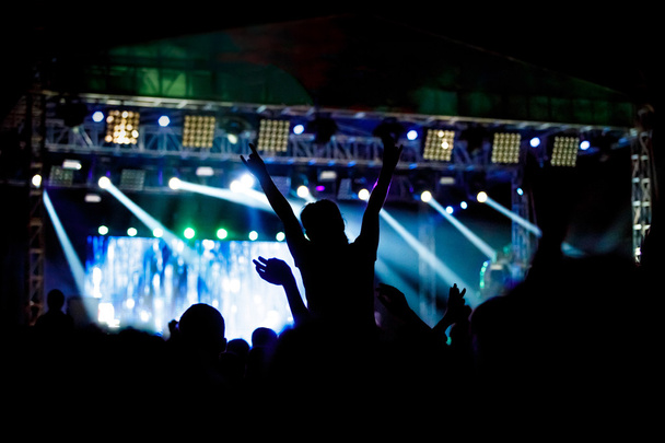 Black silhouette of young girl on rock concert - Photo, Image
