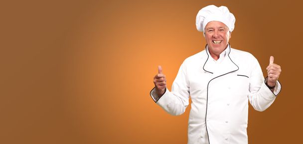 Retrato de um cozinheiro Chef com sinal de mão
 - Foto, Imagem
