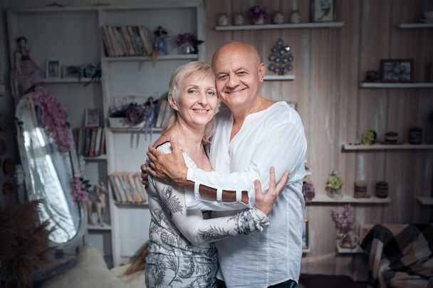 cheerful seniors couple embrace and smile; - Foto, afbeelding