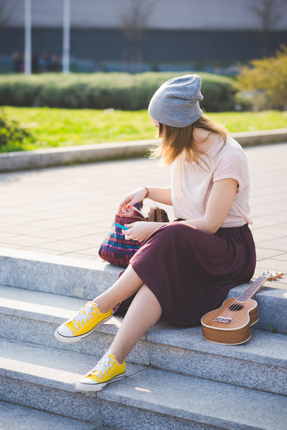 hipster woman in city with ukulele - Photo, Image