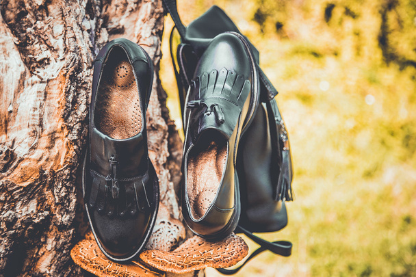 black leather shoes and a backpack, women's shoes - Φωτογραφία, εικόνα