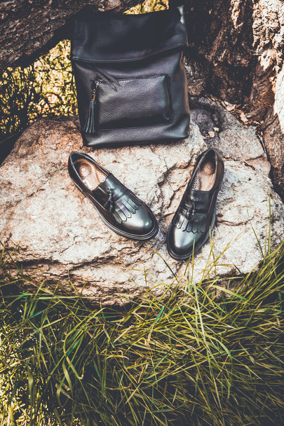black leather shoes and a backpack, women's shoes - Photo, image