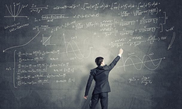 Man drawing formulas on chalkboard - Photo, Image