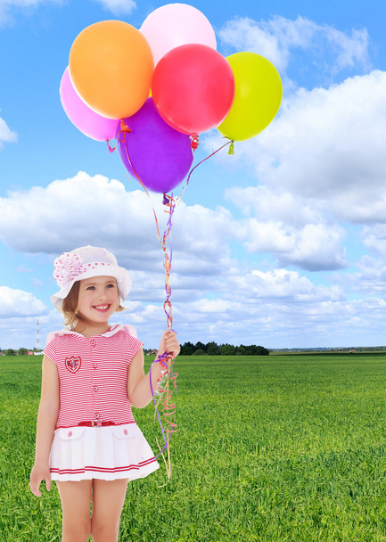 Girl holding balloons - Foto, Bild