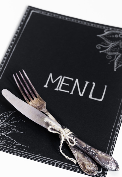 Café restaurante de menú en la sábana negra con un fondo blanco
 - Foto, Imagen