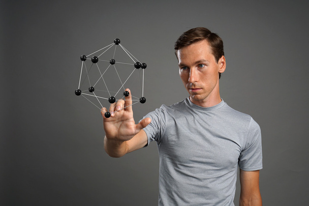Man scientist working with model of molecule or crystal lattice. - Photo, Image
