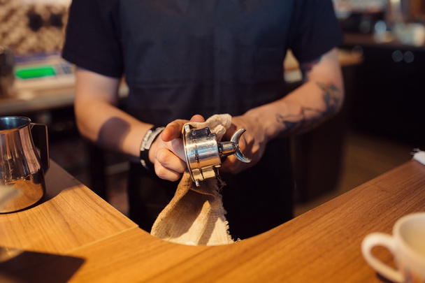 Barista at work in a coffee shop. Hands close up - Фото, изображение