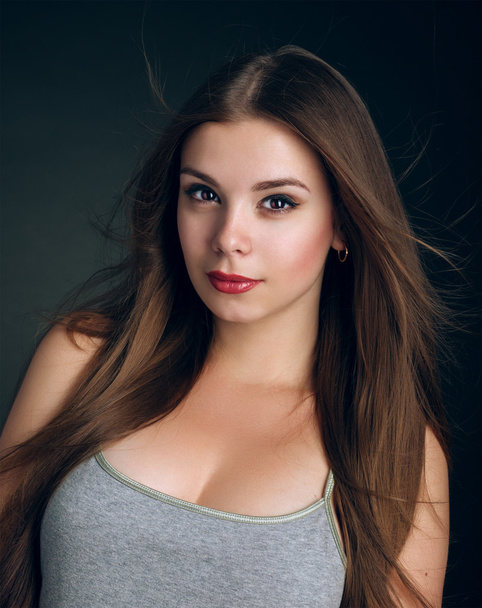 Portrait of a young beautiful brunette girl with long  hair - Fotografie, Obrázek