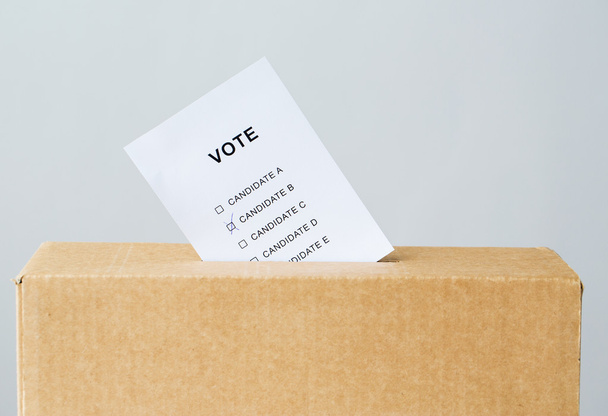 vote inserted into ballot box slot on election - Foto, Imagen
