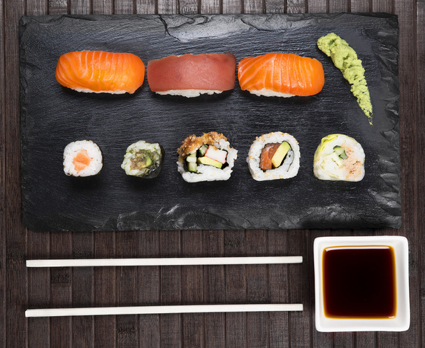 Sushi served on a slate plate - Foto, Imagen