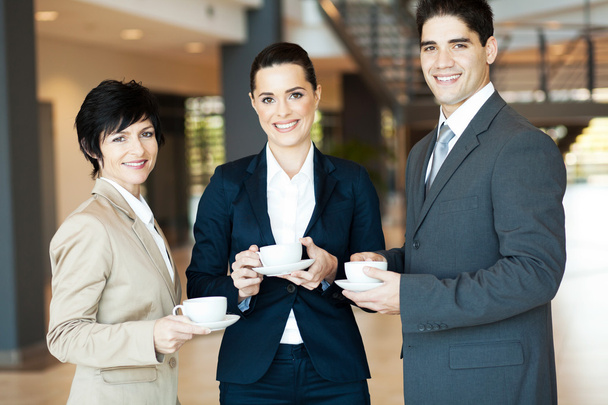 Group of colleagues having coffee break at work - Φωτογραφία, εικόνα