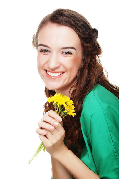 beautiful young woman with big yellow dandelions - Foto, imagen