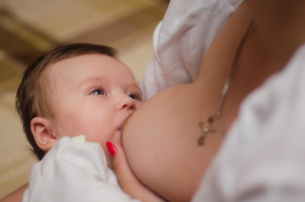Mother breast feeding newborn baby - Photo, image