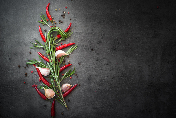 Rosemary, pepper and garlic on dark background - Foto, Imagem