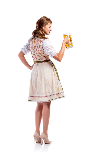 ビールを保持しているバイエルンのドレスを着た女性 - 写真・画像