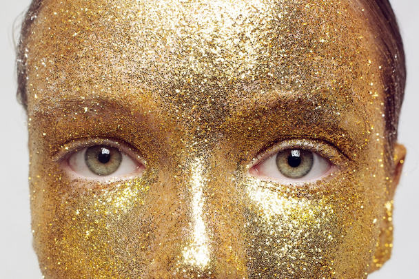 Magic Girl Portrait in Gold. Golden Makeup - Foto, Imagen