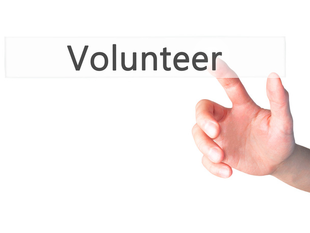 Voluntário - Mão pressionando um botão no conceito de fundo embaçado
 - Foto, Imagem