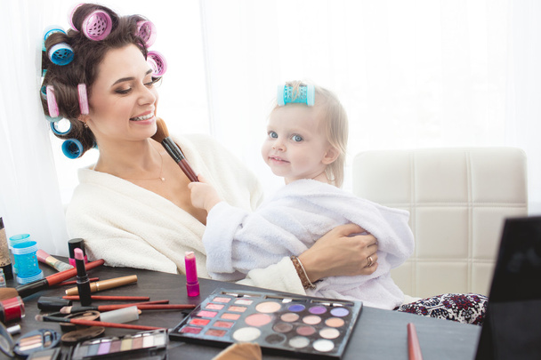 Mother and daughter are doing hair, manicures, makeup, having fun. - Fotoğraf, Görsel