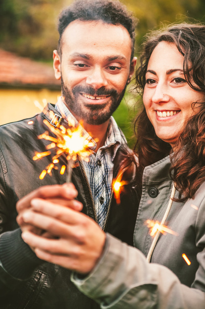 Couple Celebrating with Sparklers Outdoors - Fotoğraf, Görsel