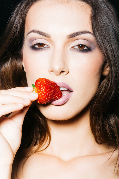 sexy woman eating red strawberry - Zdjęcie, obraz
