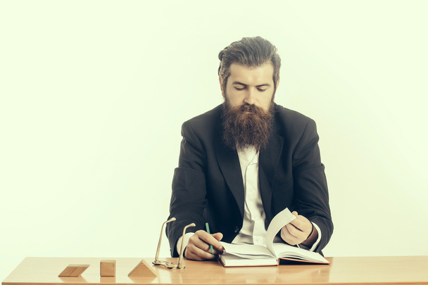 bearded man teacher at table - Фото, изображение