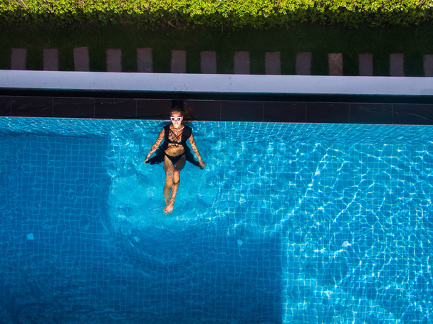 Model In swimming pool aerial view - Foto, Imagem