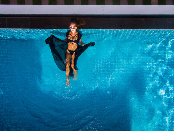 Model In swimming pool aerial view - Fotó, kép