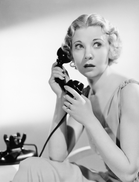 Shocked woman on telephone - Photo, Image