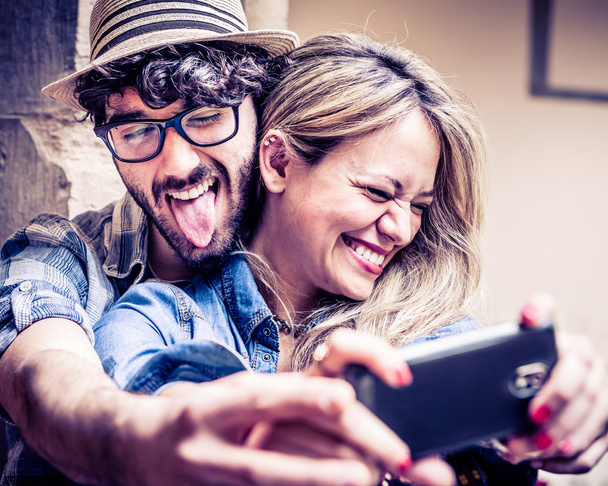Happy young couple taking selfie - Фото, изображение