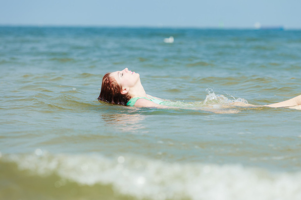 Sensual girl wet cloth in water on the coast. - Valokuva, kuva