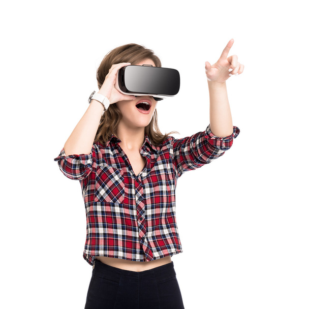 Happy girl getting experience using VR headset glasses of virtual reality, much gesticulating hands, isolated - Foto, afbeelding