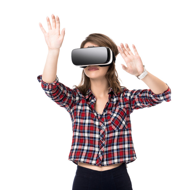 Happy girl getting experience using VR headset glasses of virtual reality, much gesticulating hands, isolated - Foto, Bild