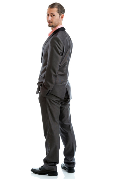 traje de longitud completa corbata hombre de negocios de pie
 - Foto, Imagen