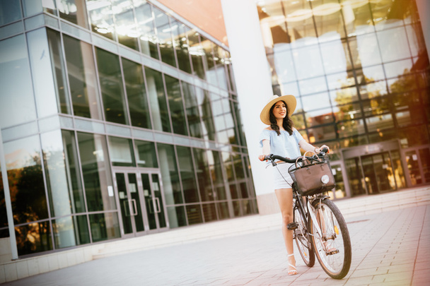 Beautiful woman using bike - Photo, Image