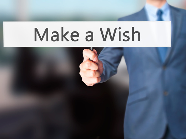 Make a Wish - Businessman hand handing sign
 - Фото, изображение