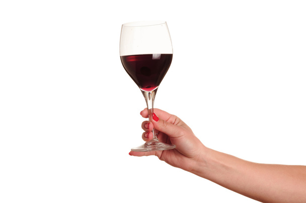 赤ワインのガラスを持つ女性の手 - 写真・画像