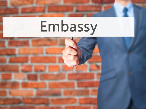 Embassy - Businessman hand holding sign - Photo, Image
