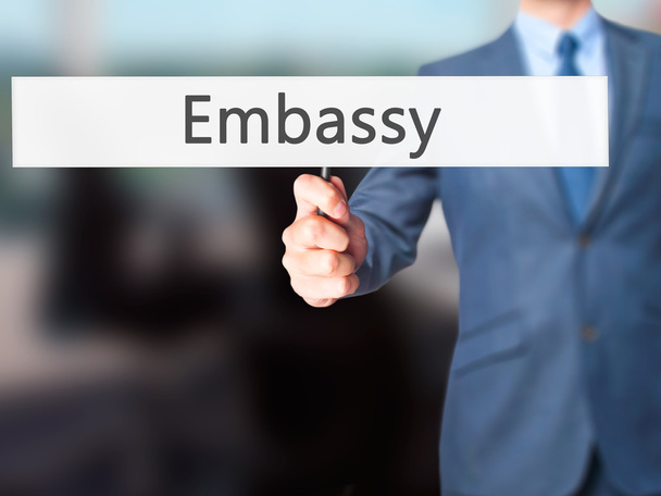 Embassy - Businessman hand holding sign - Photo, Image