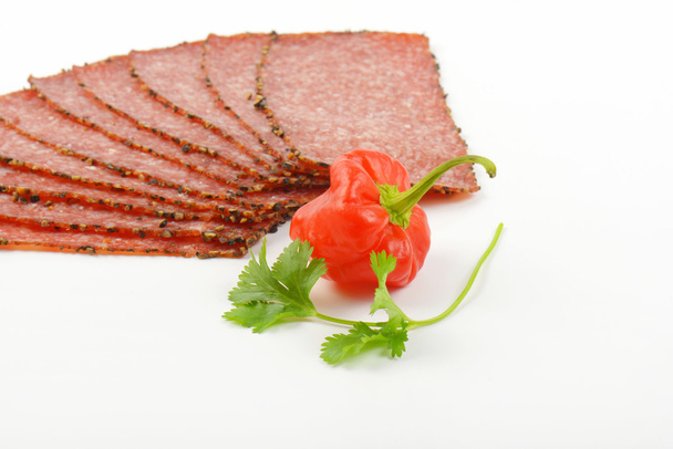 Tranches de salami au poivre noir
 - Photo, image