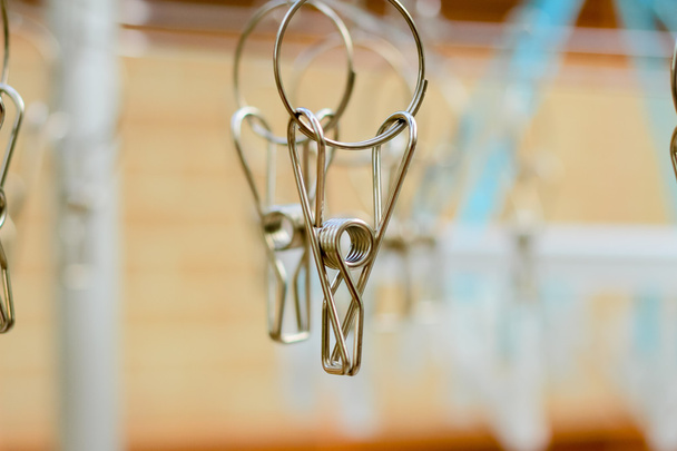 stainless steel hanging clothespins selective focus:art of cloth - 写真・画像