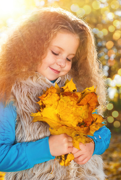 Beautiful Girl with Red Curly Hair in the Autumn Park - Photo, Image